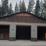 Custom 3-car garage build in Coeur d'Alene Idaho with durable exterior construction and a clean finished design