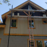 Exterior remodel project in Hayden Idaho with siding windows soffit and fascia improvements completed with scaffolding