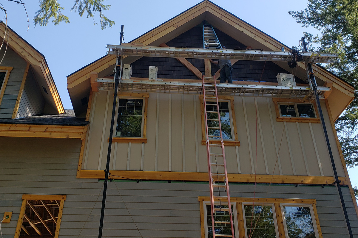 Exterior remodel project in Hayden Idaho with siding windows soffit and fascia improvements completed with scaffolding