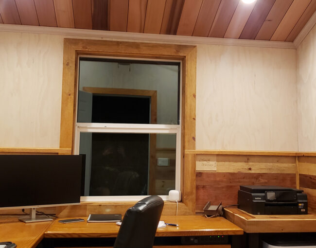 Custom window replacement project in Coeur d'Alene ID with timber interior and exterior trim designed to match the home's existing style